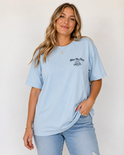 Blue Sky Bay Embroidered Comfort Colors® T-Shirt | Officially Licensed Laura Pavlov Merchandise